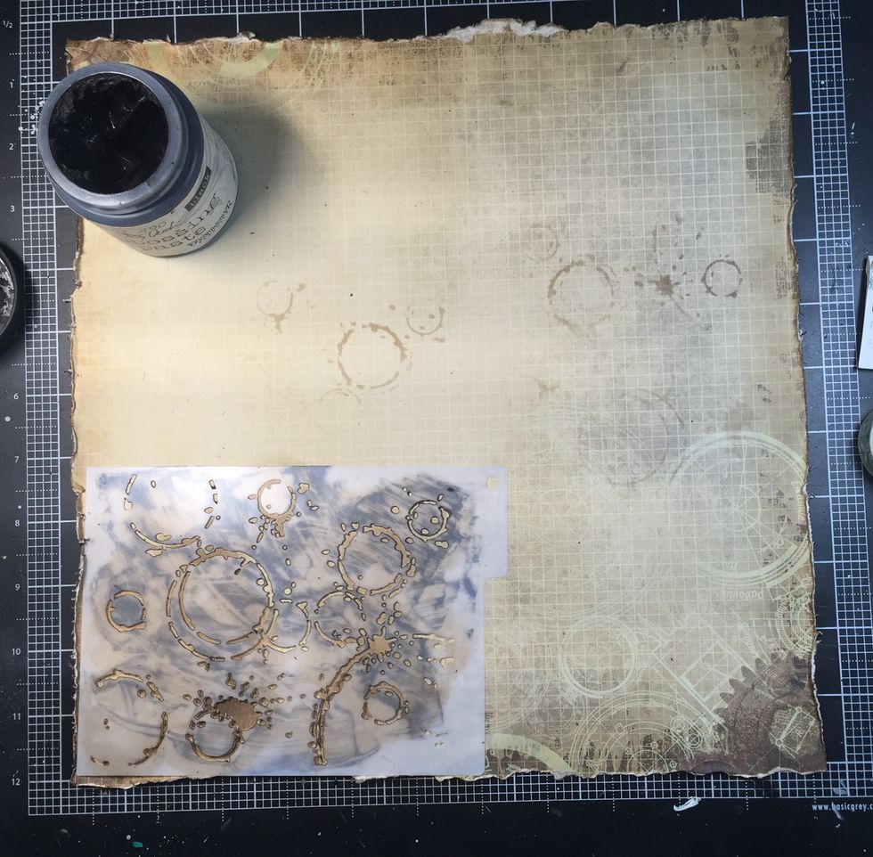 For this layer, I cut a 1/2 inch off of two sides. You can see I have used ink on the stencil: this helps guide me where to use the paste. It also give a great dimension leaving some ink exposed.