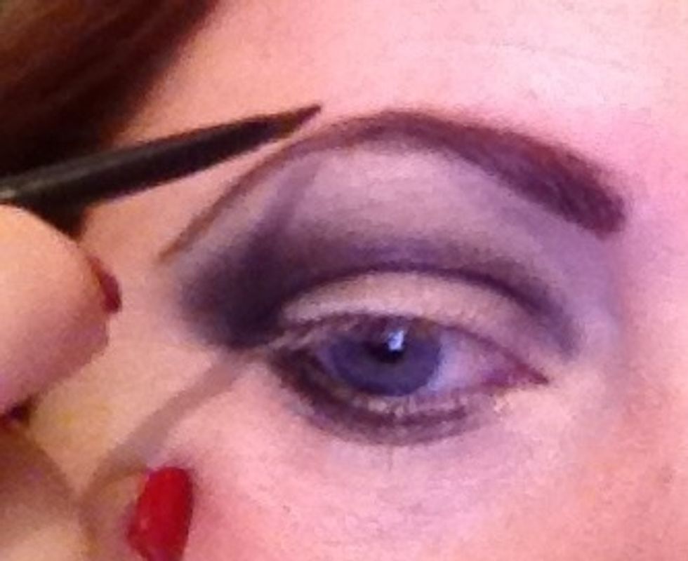 For this look because it's so intense you can get away with stronger brows I've used a mix of a brow pencil and powder.