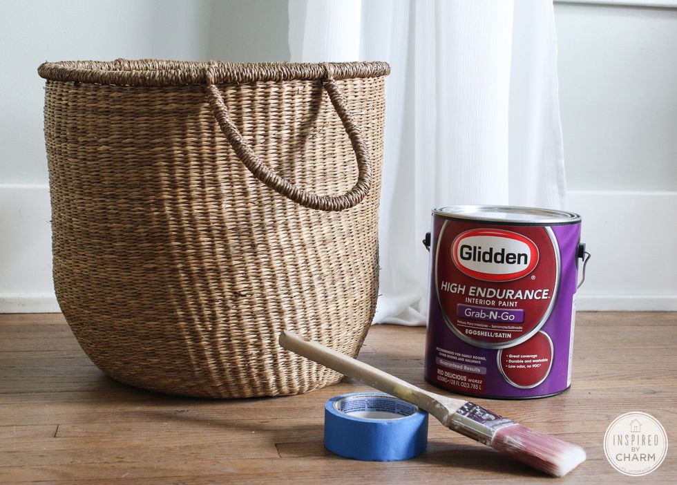 For this project you only need a few supplies. Grab a basket, paint brush, and painters tape. You'll also need some paint. I love Glidden's Red Delicious Color (available at Walmart).