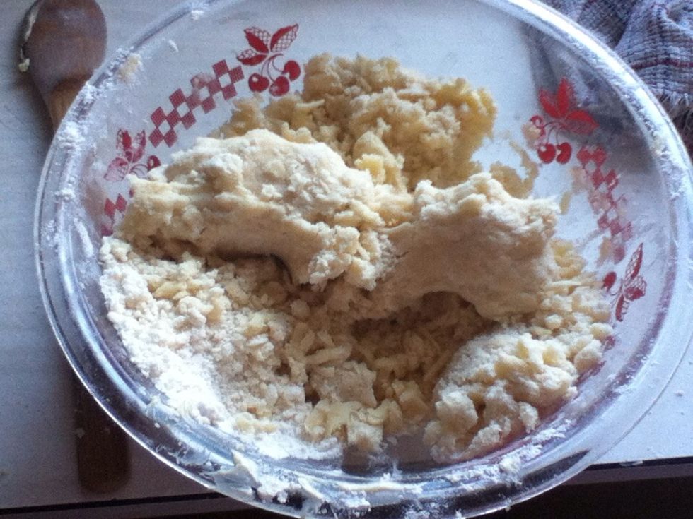 For this recipe, in a large bowl mix the flour, sugar, and salt together. Then with your fingers rub the butter in until smooth dough is formed.