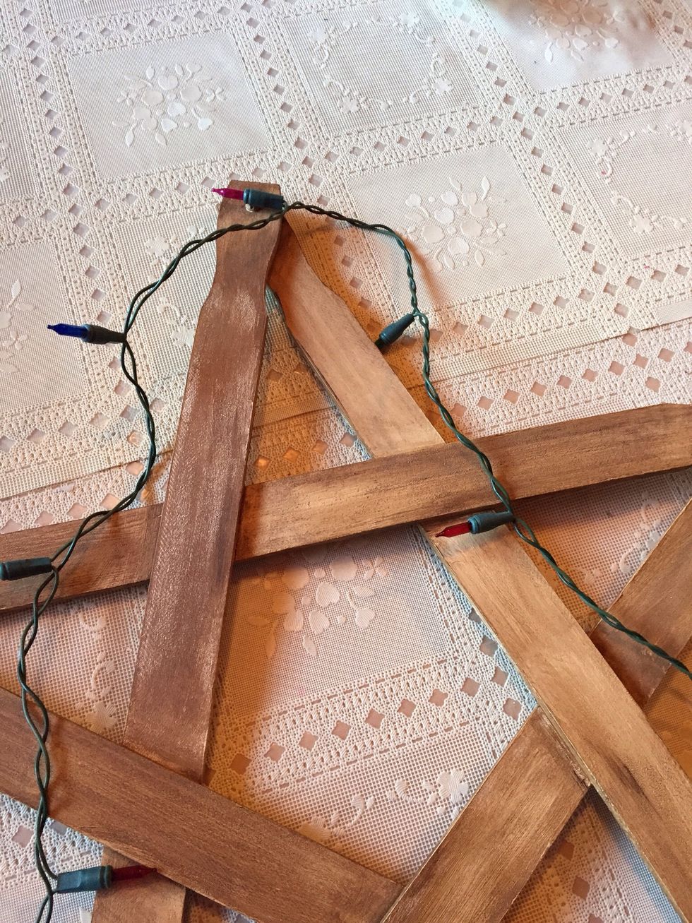 For this star, I used a strand of 50 lights. Find middle of strand, and begin wrapping half of the strand around star. (Wrapping half at a time is much easier than wrapping the whole strand)