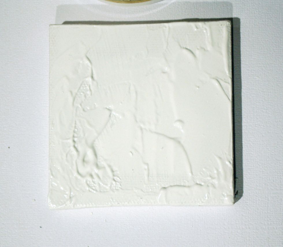 For this tutorial I used a small 3"x3" canvas. I first coated with white gesso. Once dried apply a generous amount of Textures Paste: White Crackle from the Mediums-add on. Allow to dry overnight.