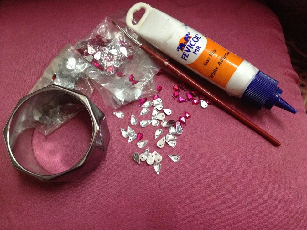 For this u will need a bangle,glue,brush,few stones(u can get then at a craft store,any kind any shape will do I found these at home so used them)