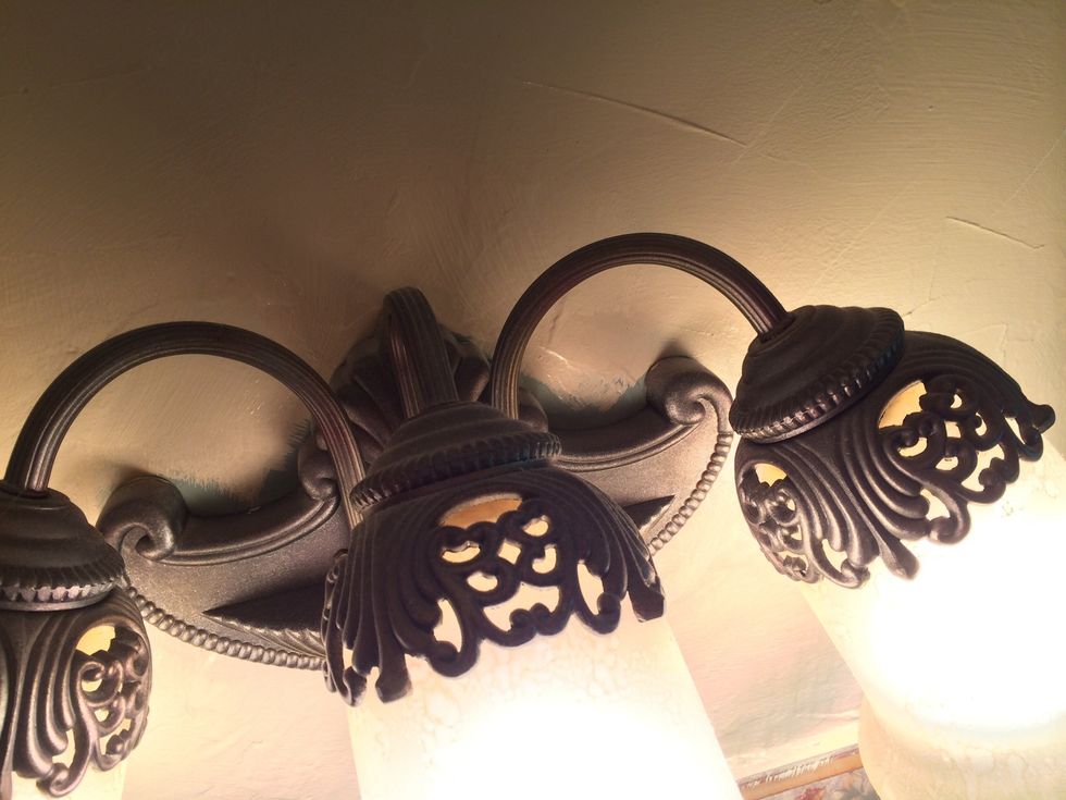 For tiny areas around lights and little crevices, don't try to cut in with your paint brush unless you have protected the area with tape or have a really steady hand.