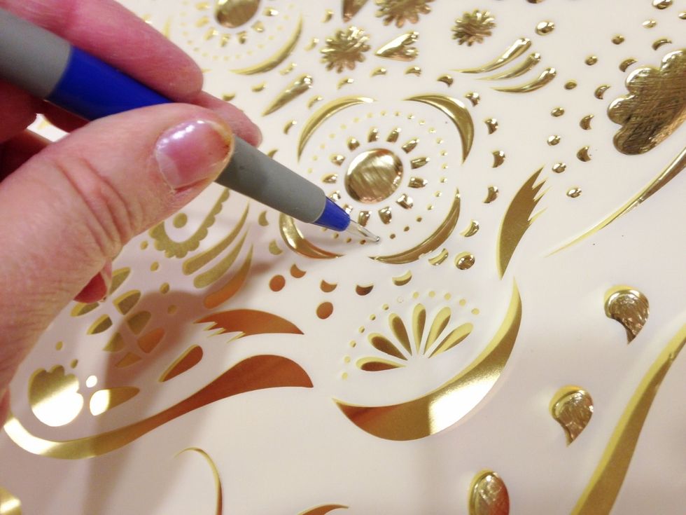 for tiny dots, use small end or stylus, insert in stencil and press and rock to emboss.