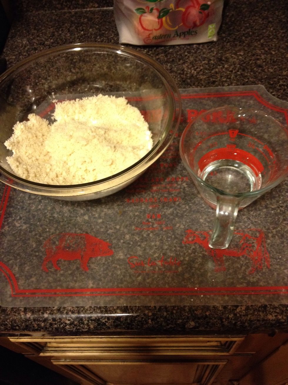 For two crusts, the box states to use the package of mix and 1/4 cup of water. Then, mix together.