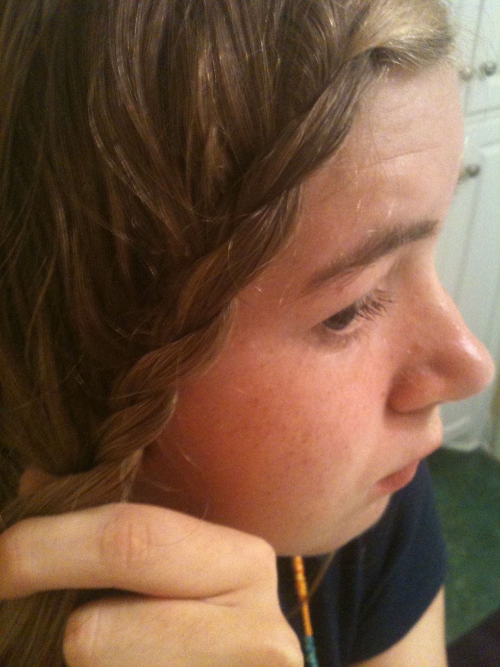 Forgot to mention: while ur French braiding, pull it away from ur face and keep it tight. When you finish that part, it should look something like this. If u want, u could leave it like this and pin