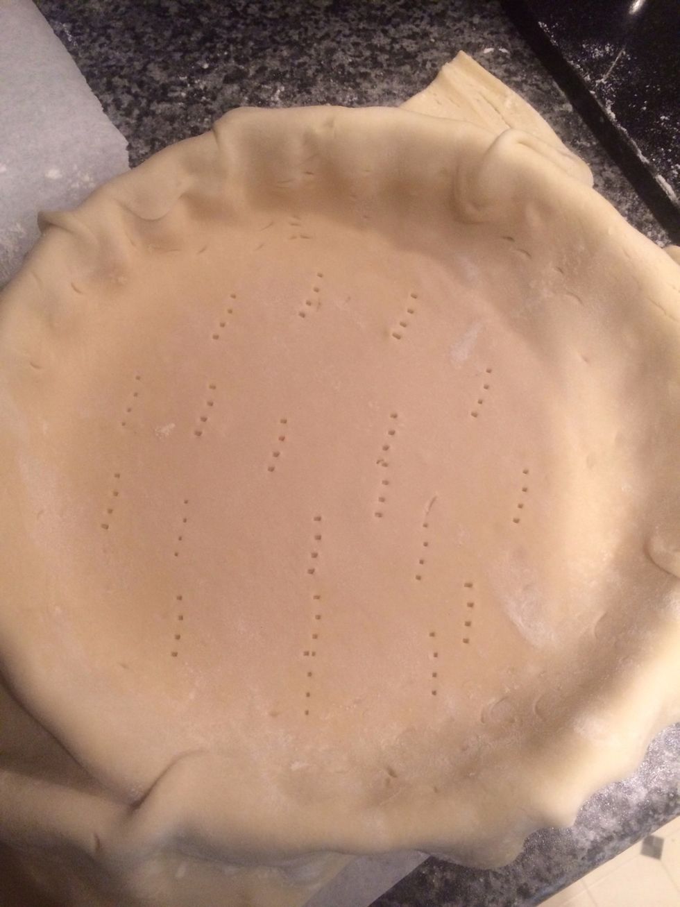 Fork the bottom of the pastry (helps cooking) and cut off the excess from rim of dish - you will use the excess for the top!