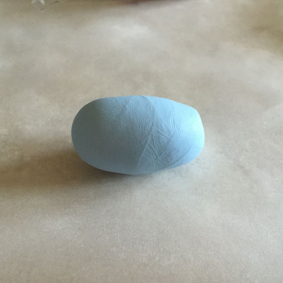 Form a ball in your hands. Roll out into rectangular shape. This will be the body.