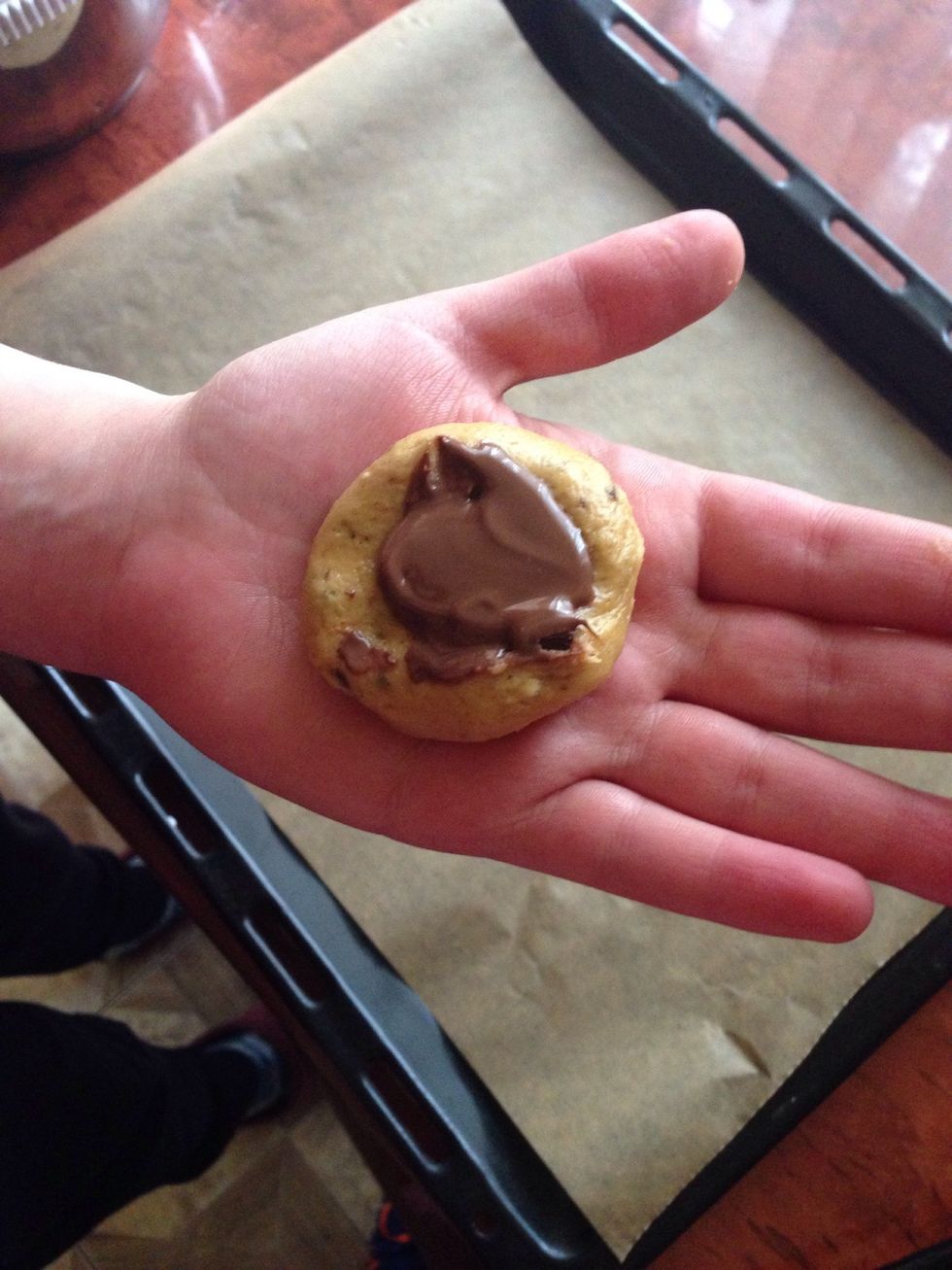 Form balls and put a tsp nutella in the middle of each ball