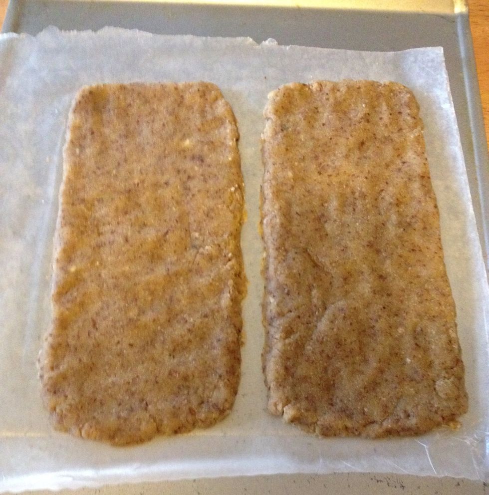 Form each half into a rectangle about 10 by 4 inches on prepared baking sheets.