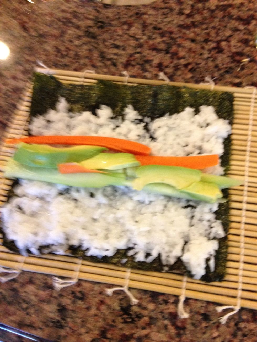 Form ingredients width-wise, but we scootched them down a bit more than this before rolling because the first rolling motion needs to capture all the veggies. I like them to stick out the ends a bit.