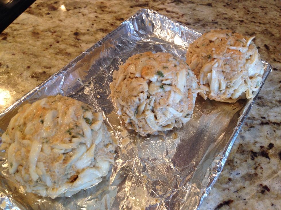 Form into balls, about the size of a baseball. Place on a greased pan, and put in your freezer for about 20 minutes (helps hold the shape during cooking).
