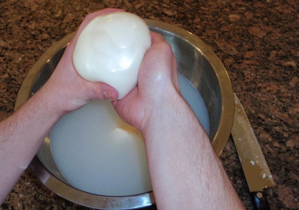 Form the cheese into a smooth ball if slicing and eating or serving in Caprese Salad, or if you would like to make a meat and cheese roll, spread the cheese evenly into a flat square piece.