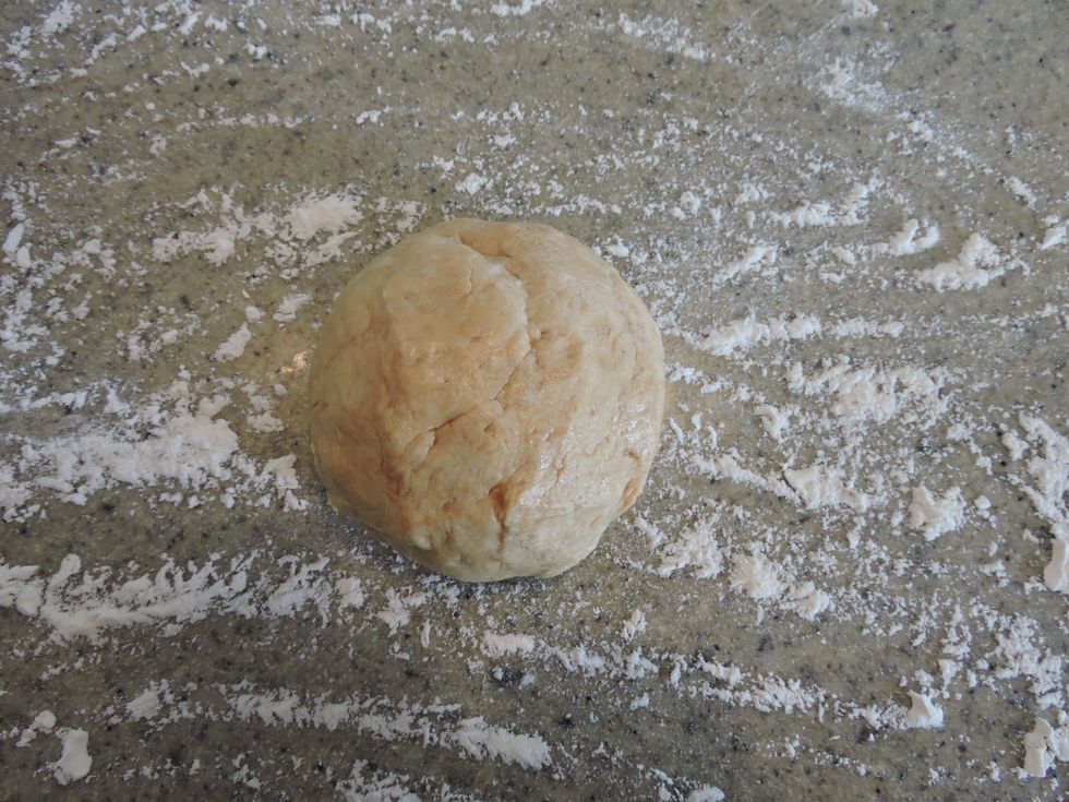 Form the dough into a ball and place on the floured countertop.