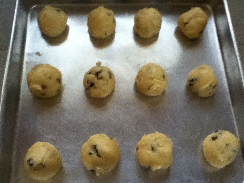 Form the dough into small ball and place on the baking tray.