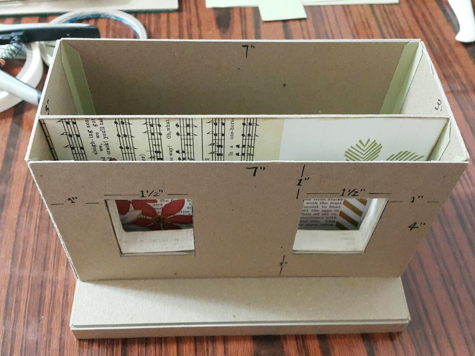 Form the shop body into shape using connecting strips, better to adhere papers for the middle chipboard beforehand.