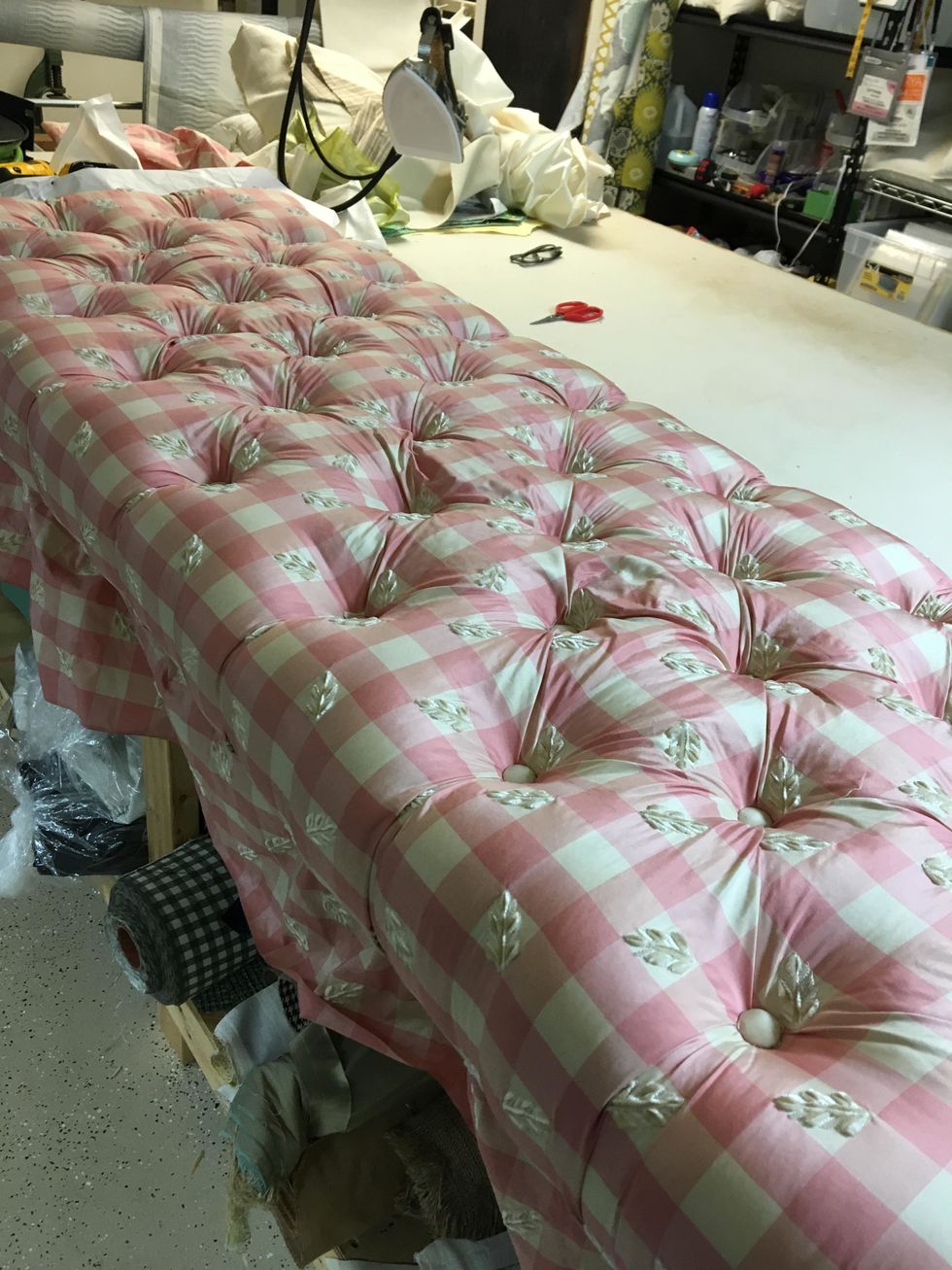 Form tucks or folds between buttons as you go. It should look like this.