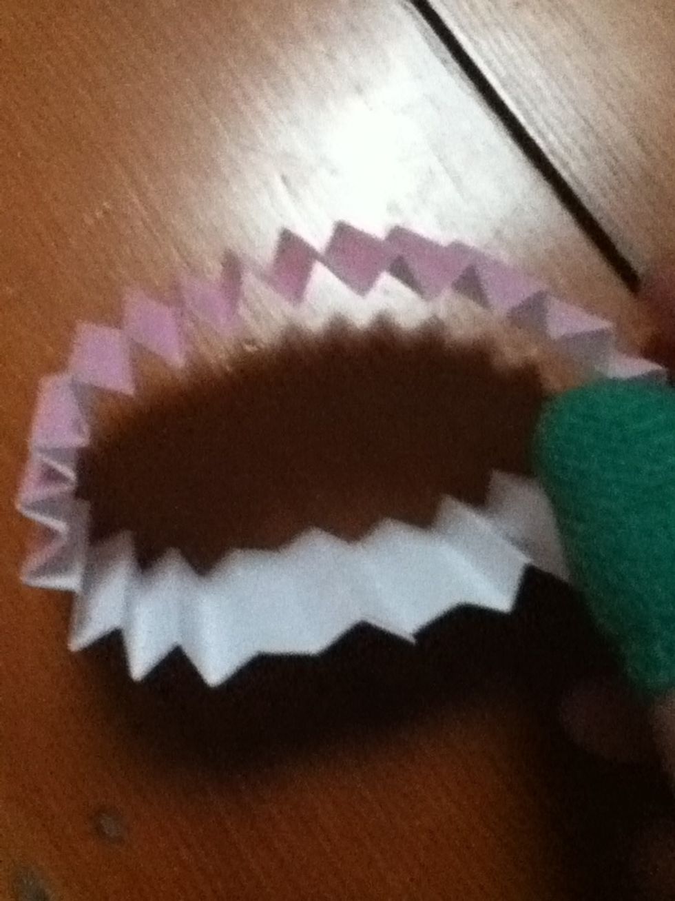 Forming a pleated ring.