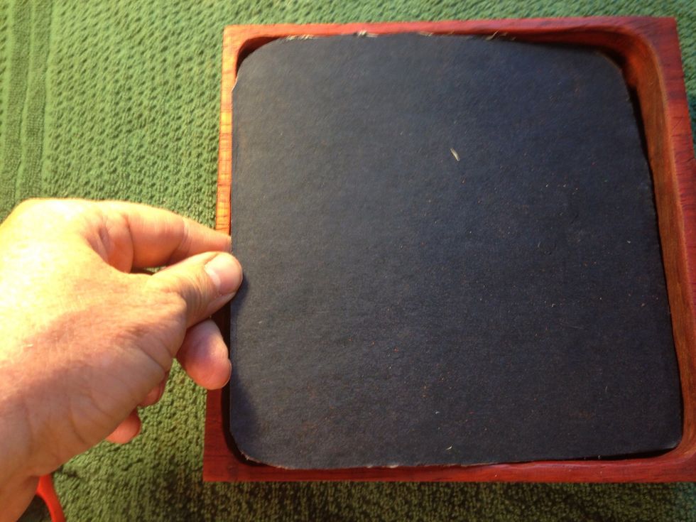 Found the back plate to a picture frame and started to trim to fit. Take off with knife or scissors. Take a little bit at a time, you can't add it back once it's gone.