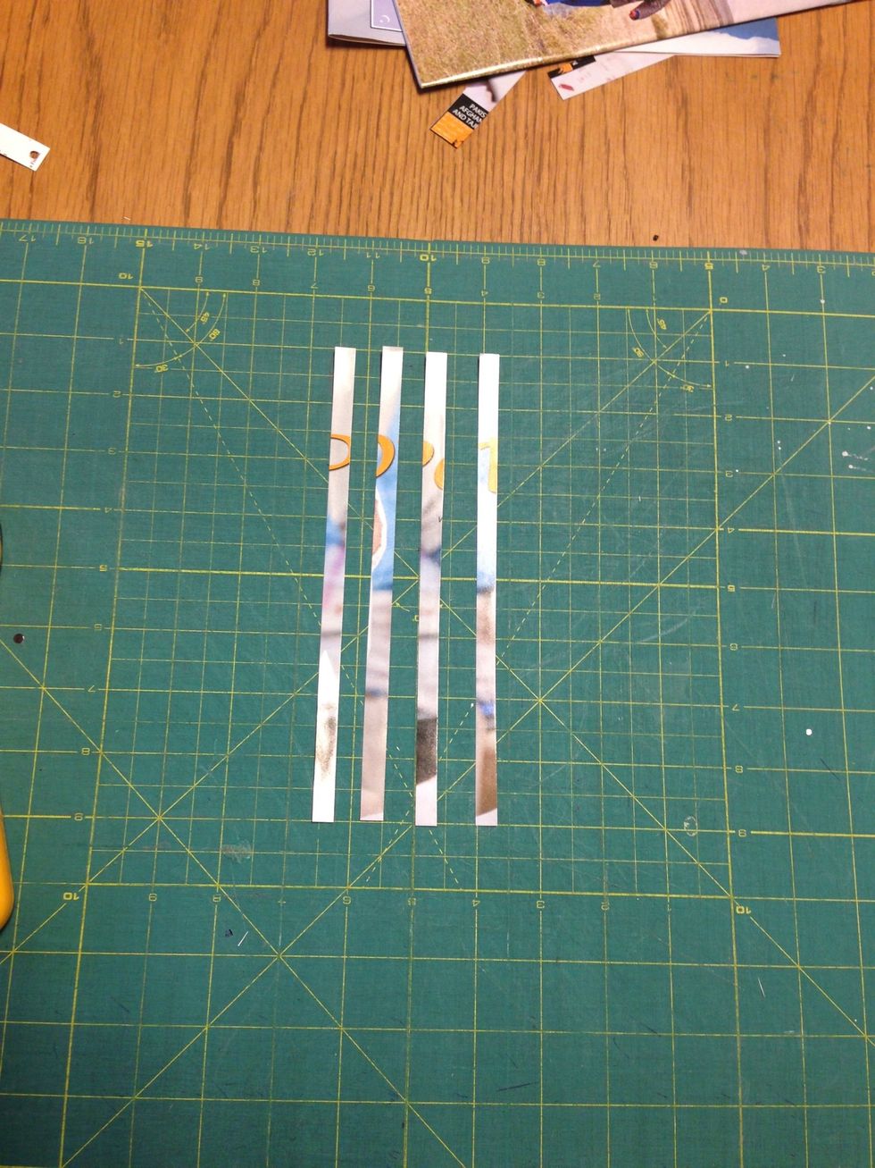 Four 8" x 1/4" strips of paper.