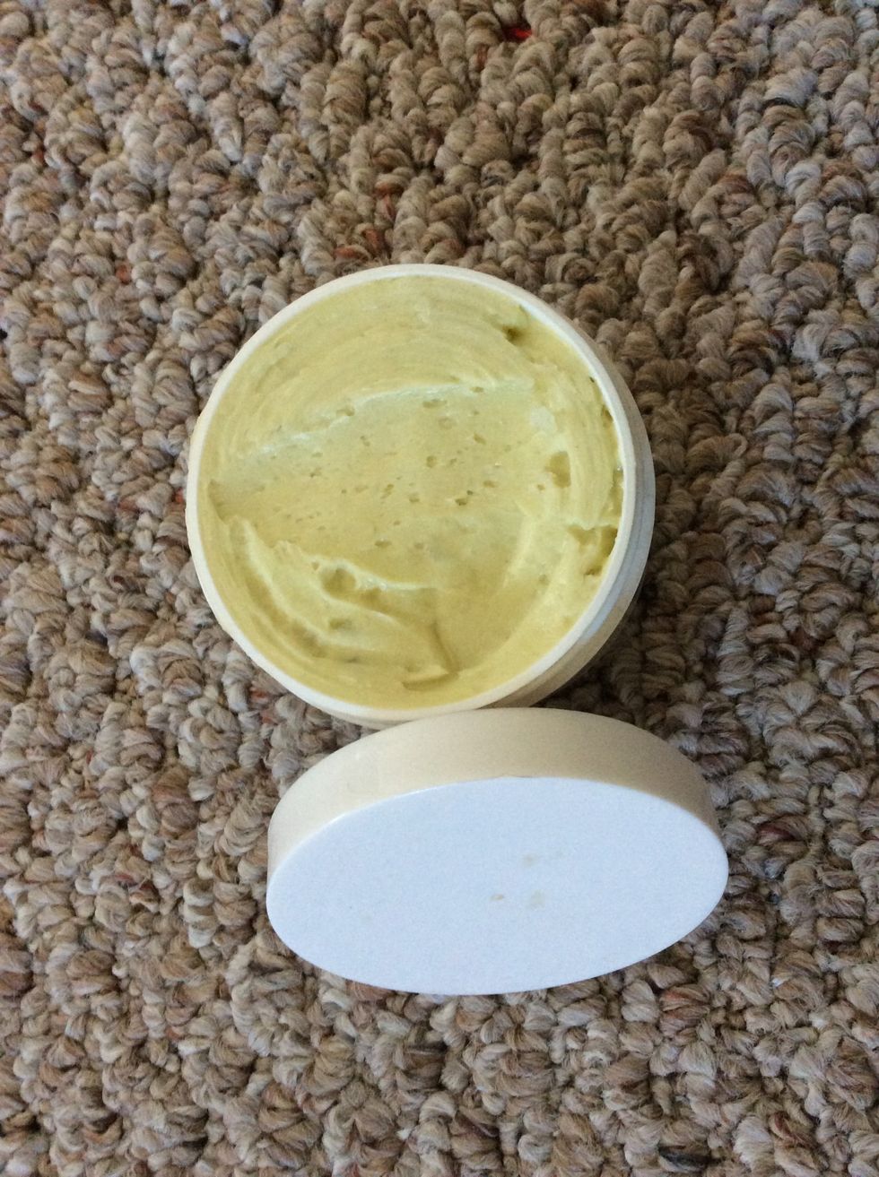 Fragranced, whipped body butter in recycled plastic container. It's so smooth! And it feels great on my skin. Can also be used as a low SPF sunscreen, conditioning hair mask, and make-up remover.