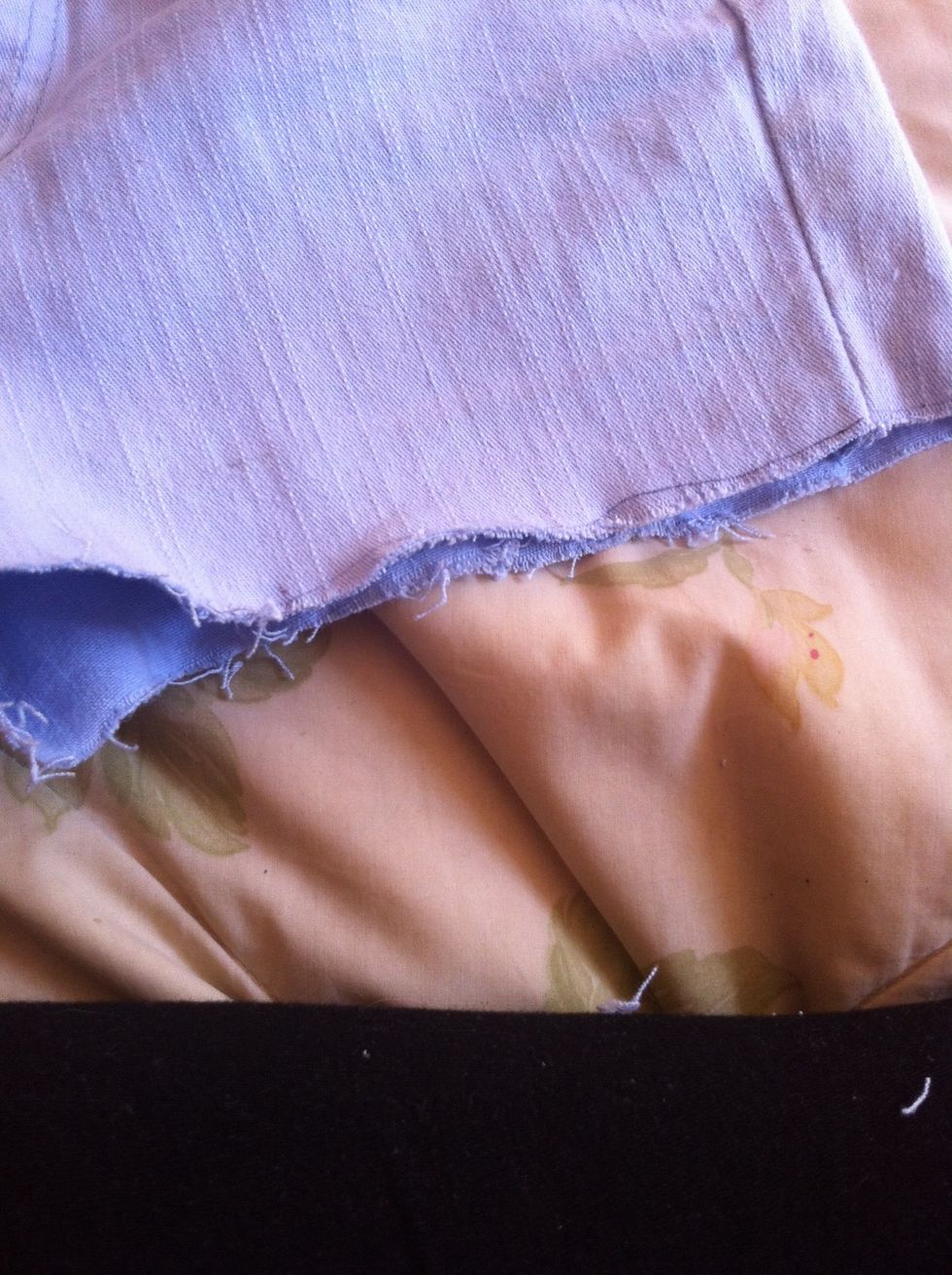Fray the edges by running a the scissors open, along the edge on the shorts