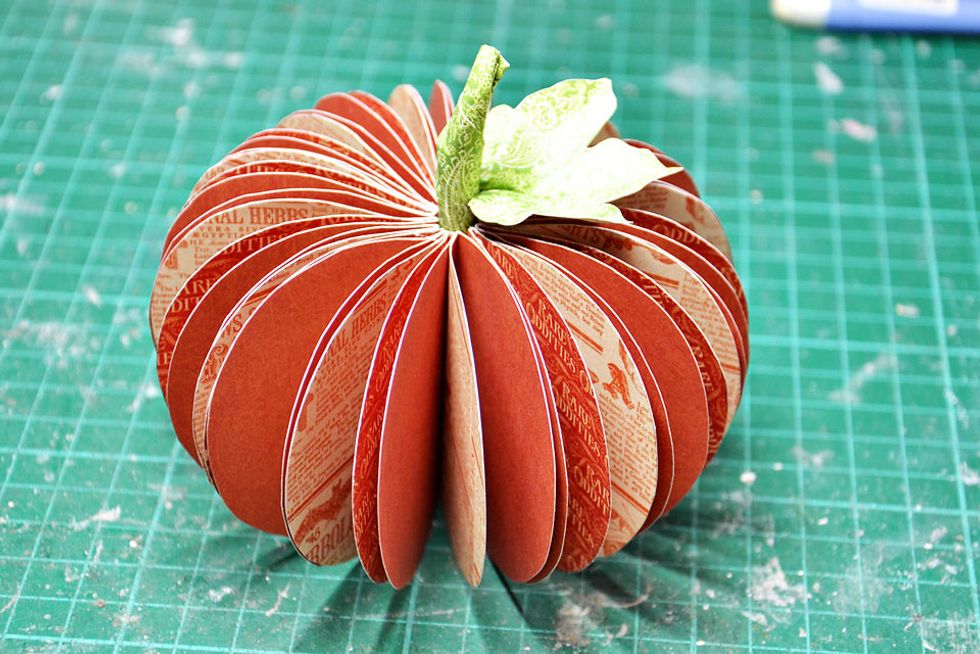 Free cut a paper leaf for the top and attach to the stem.