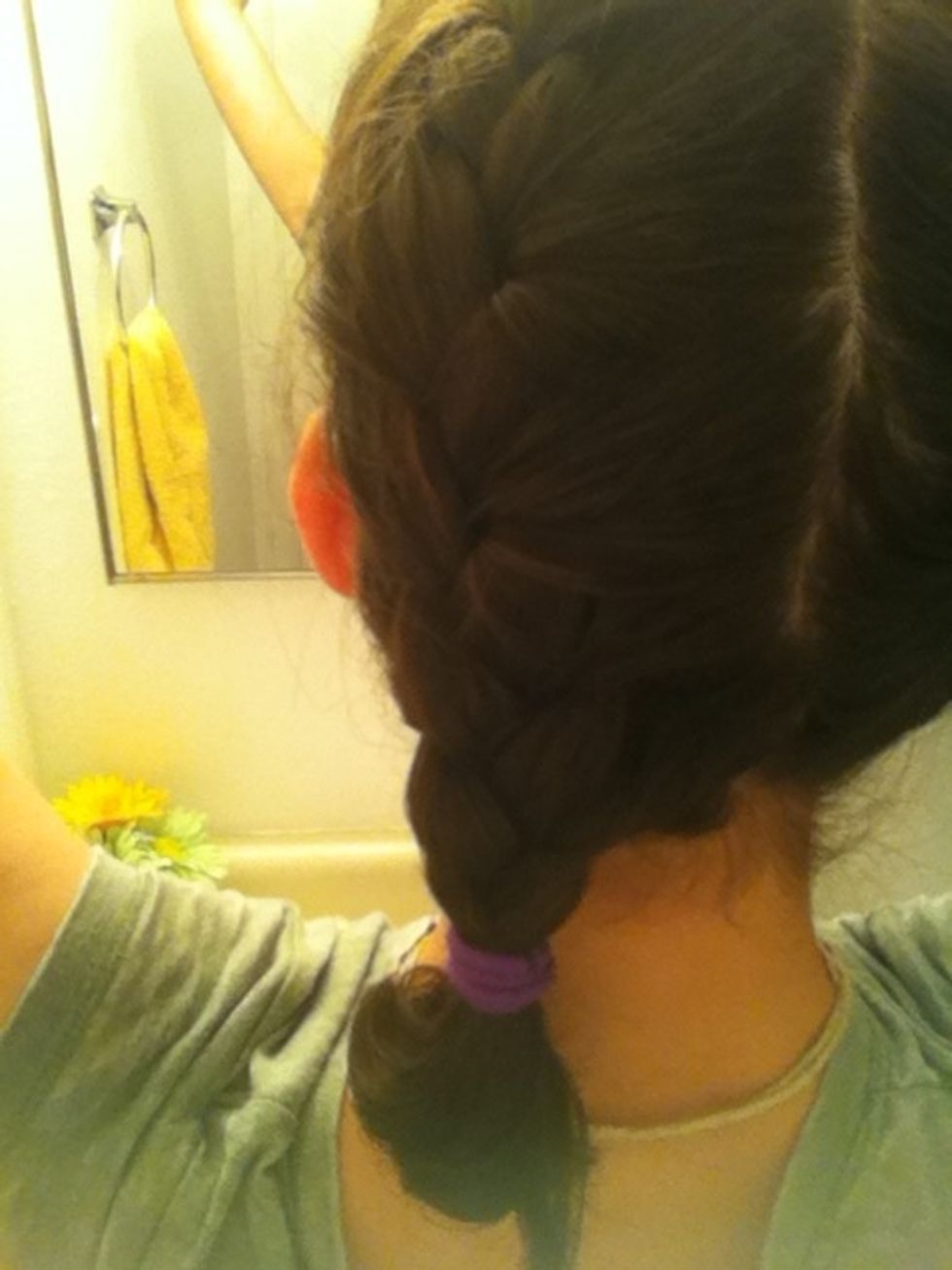 French braid the side of hair and end it with a pony tail. I will be making a video soon on French braiding.