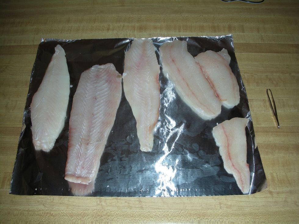 Fresh caught fluke!  The 2nd fillet from the right, and the one in the upper right-hand corner, were used in the recipe.  They totaled about 1 lb.
