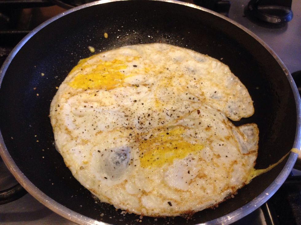 Fried eggs are complete when both sides look similar to this. Remove from pan and place on a plate to let them cool down. When they are cool enough, roughly chop them into small bite size pieces.