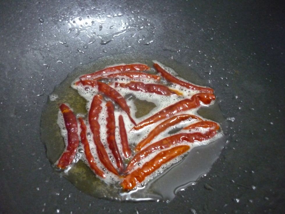 Fried your dried chilli in hot oil for 5 mins or until it turns brown and crispy. Set aside.