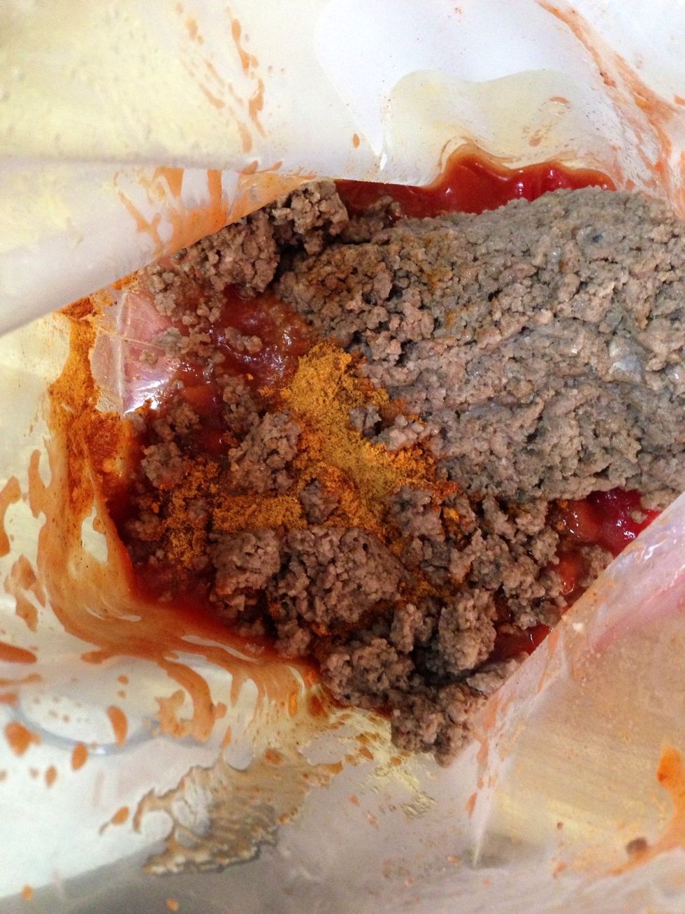 FRITO PIE Pour the beef, tomato sauce, chili beans, diced tomatoes, and taco seasoning into a ziploc bag. Push the air out and mush all of the ingredients together to combine. Label your bag.