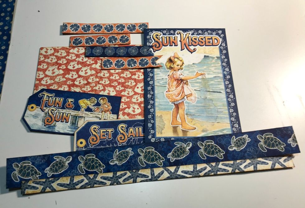 From border paper, cut 4 borders, 2 tags & 2 4x6 cards. Cut border 1 - 9", #2 - 8 3/4", #3 - 3", 3 1/2" & 3" - make a banner, #4 - 3 1/4" - make a banner. Ink edges with Vintage Photo Distress Ink.