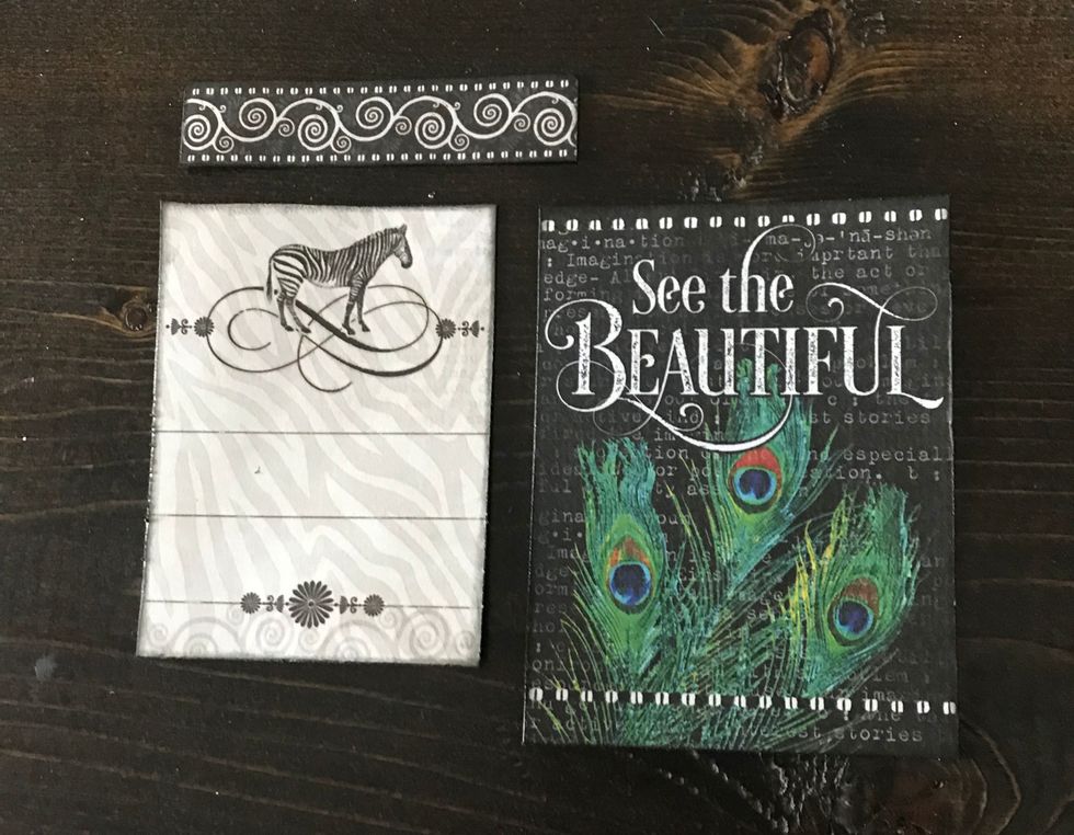 From ephemera pack, take out cards with a zebra & see the. Cut border off zebra card & then cut to 2 1/2"x3 1/4". Cut beautiful card to 2 3/4"x3 3/4". Distress edges & ink all pieces with black ink.