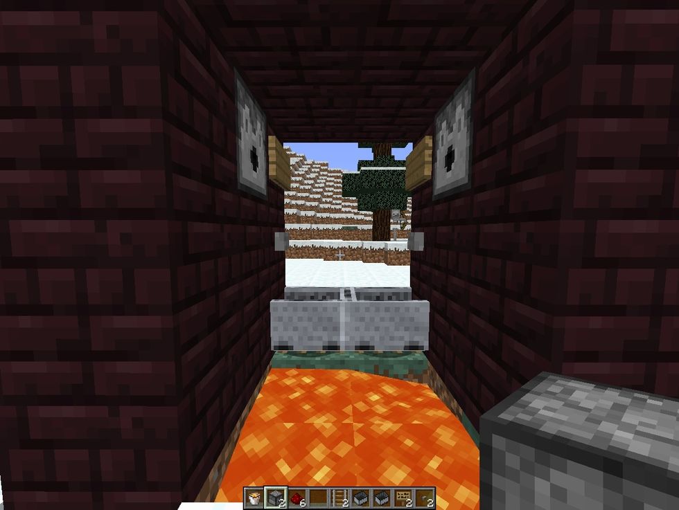 from outside, press the button again to put lava back and hide the door.