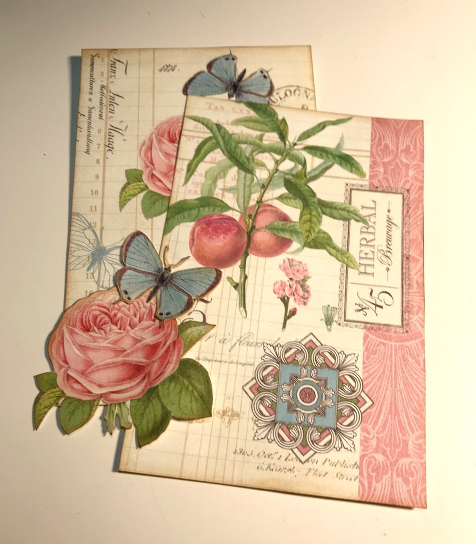 From the 4" x 6" card, fussy cut the Herbal card & rose/butterfly card. From a second rose/butterfly card, fussy cut the rose & butterfly. Ink edges of card & images with Vintage Photo Distress Ink.