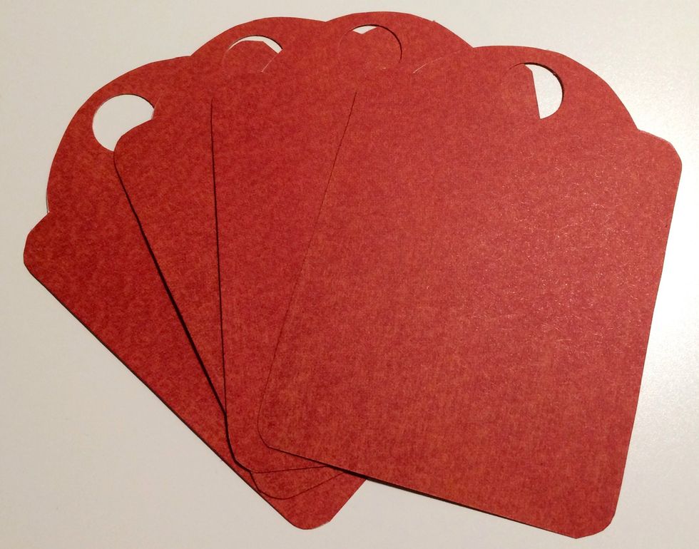 From the 6x6 pad, pull out 2 red dot papers. Trace a Thanks tag 4 times on the red dot paper. Cut each tag out. With a 1/2" circle punch, punch a hole at the top of each tag so the eyelet can fit.