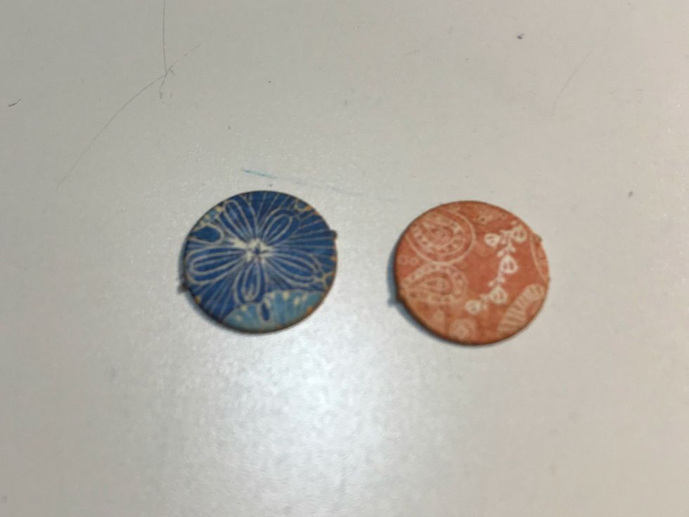 From the banner package, punch out two circles. Ink the edges of the circles using Vintage Photo Distress Ink and a blending tool with foam.