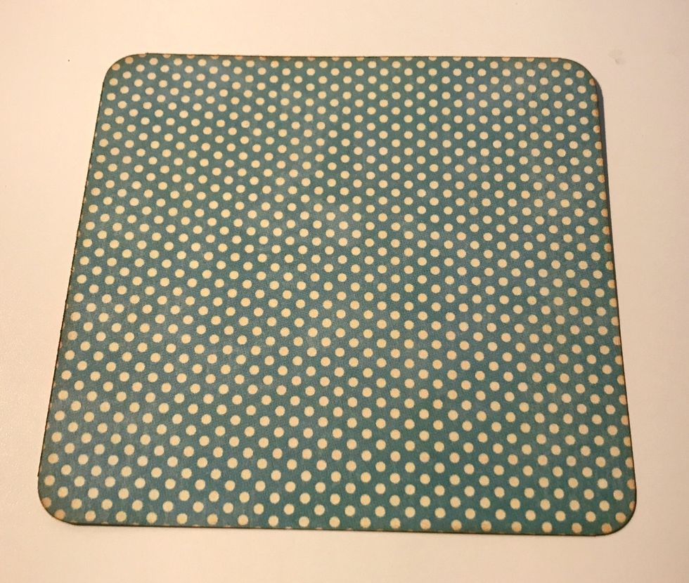 From the blue polka dot paper, cut a piece that measures 4 1/4" x 4". Round the corners. Ink the edges of the paper using Vintage Photo Distress Ink and a Blending Tool with foam.