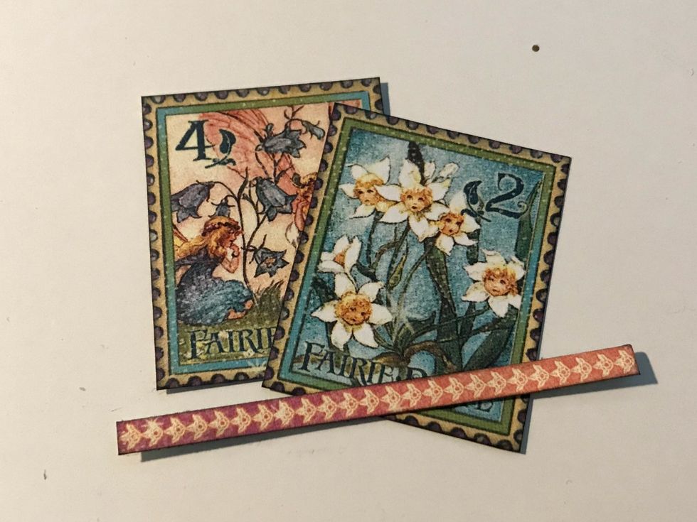 From the border paper, fussy cut 2 stamps out as well as the pink flower border. Cut the pink flower border to 2 3/4" long. Ink the edges of the border using Photogenic Ink and a blending tool.