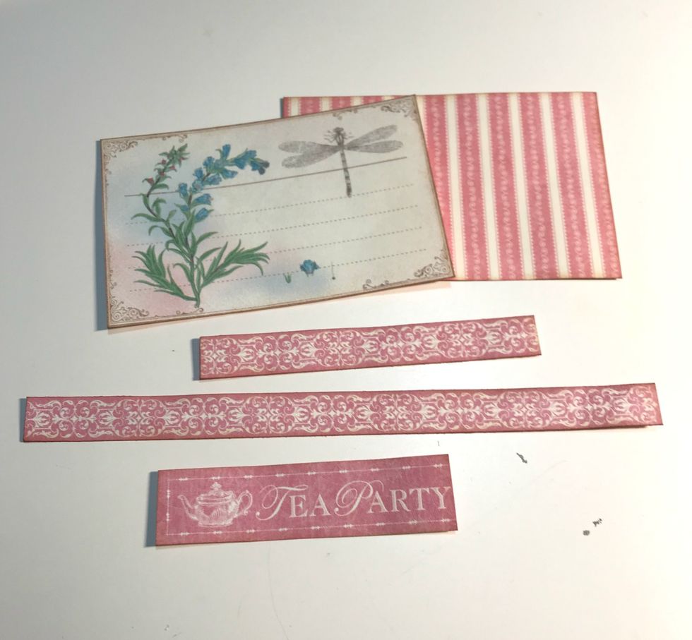 From the borders & cards paper, cut out 2 cards. Cut the pink border in two pieces, 1. 2 1/2" & 2. 6 1/2" long. Cut out the Tea Party word from the border. Ink the edges with Vintage Photo Ink.