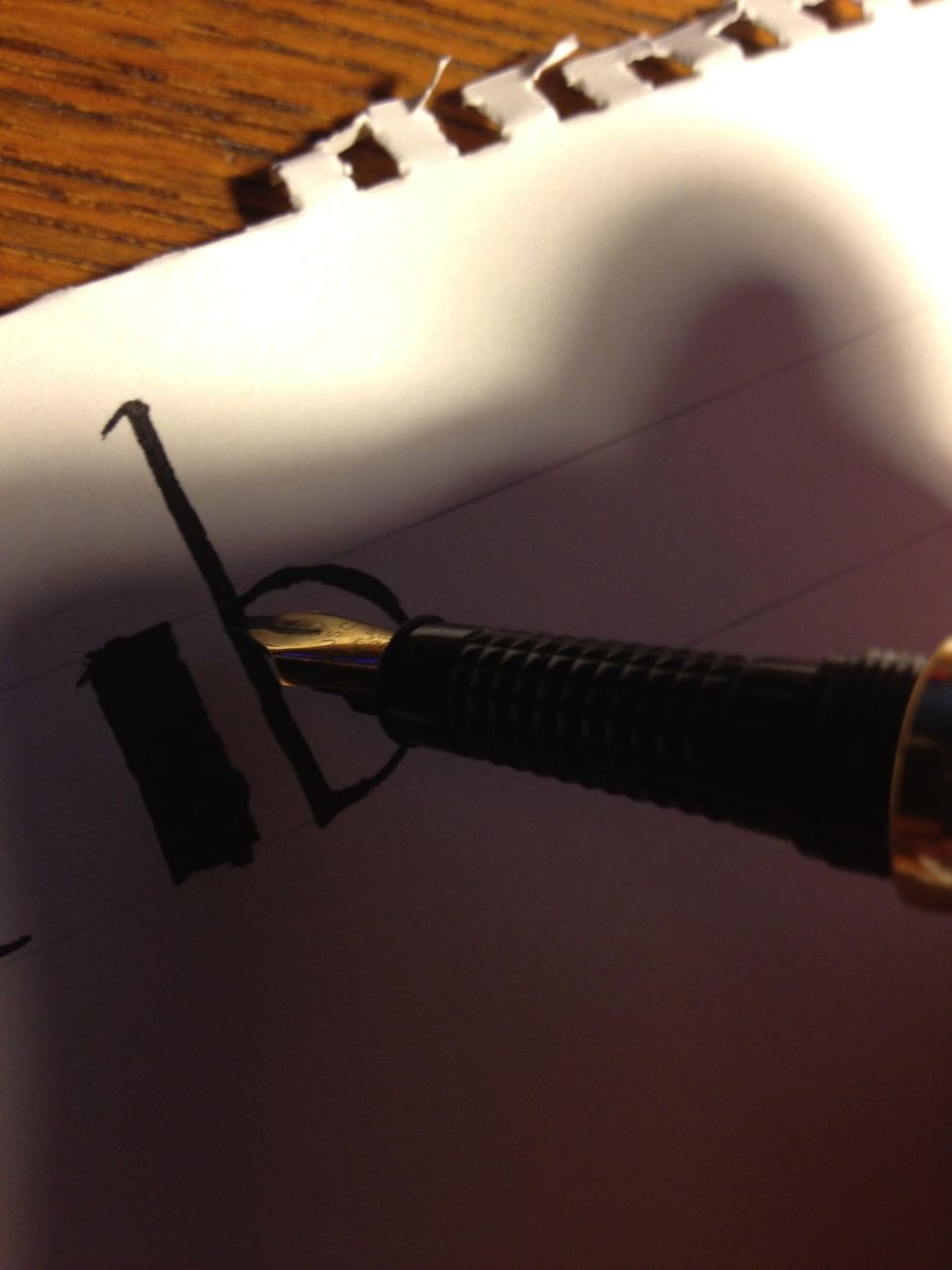 From the bottom, go right into the second part: draw a half-circle, maintaining nib angle, up to about a third to halfway up the trunk. I made mine a little exaggerated for demonstration purposes.
