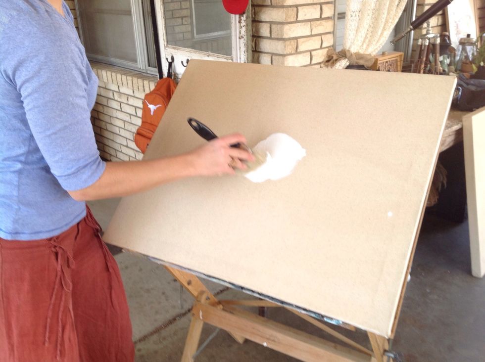 From the center, paint in a circular motion to work the paint into the fibers.