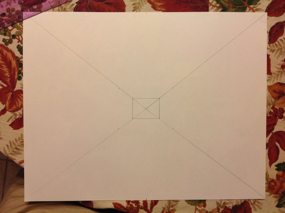 From the center point measure out to 2 inches on the diagonal lines. Make a dot at the 2 inch measurement on each line.
