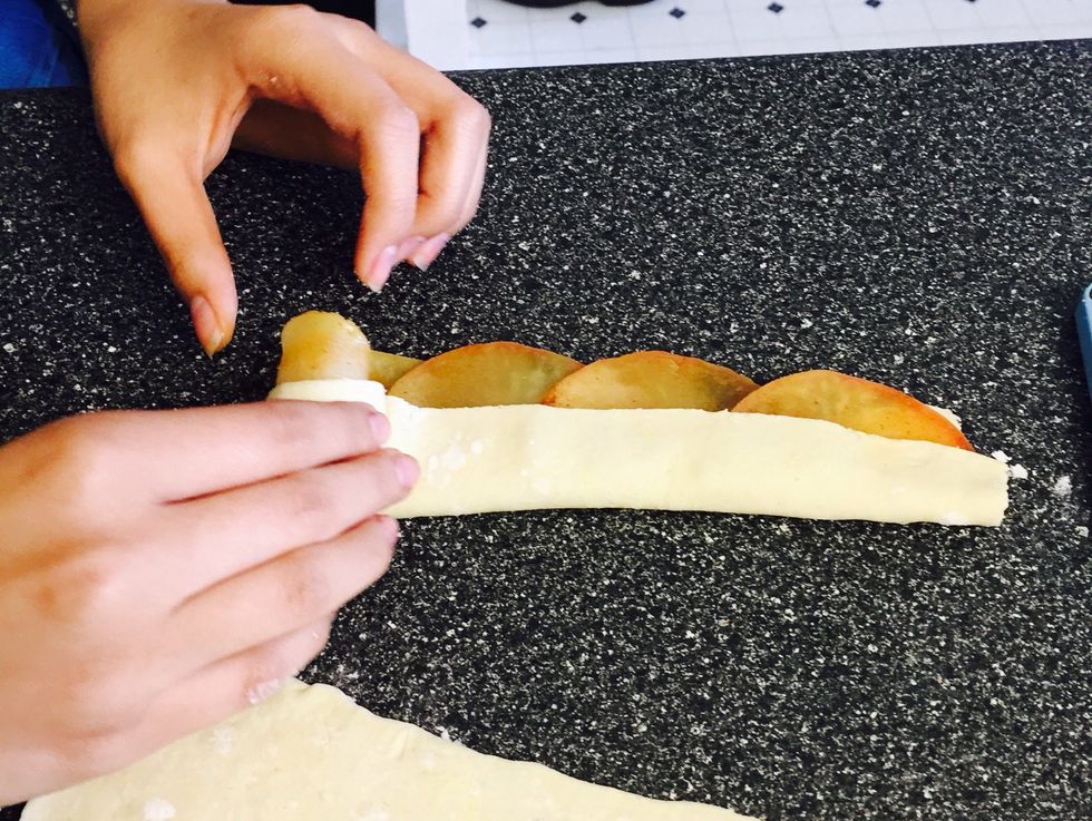 From the corner, lightly start rolling