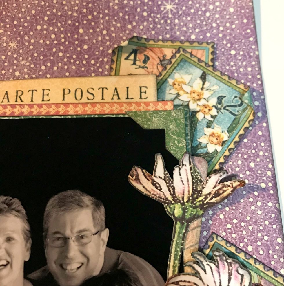 From the Decorative Stickers, pick a photo corner and adhere it in the top right hand corner of the photo.