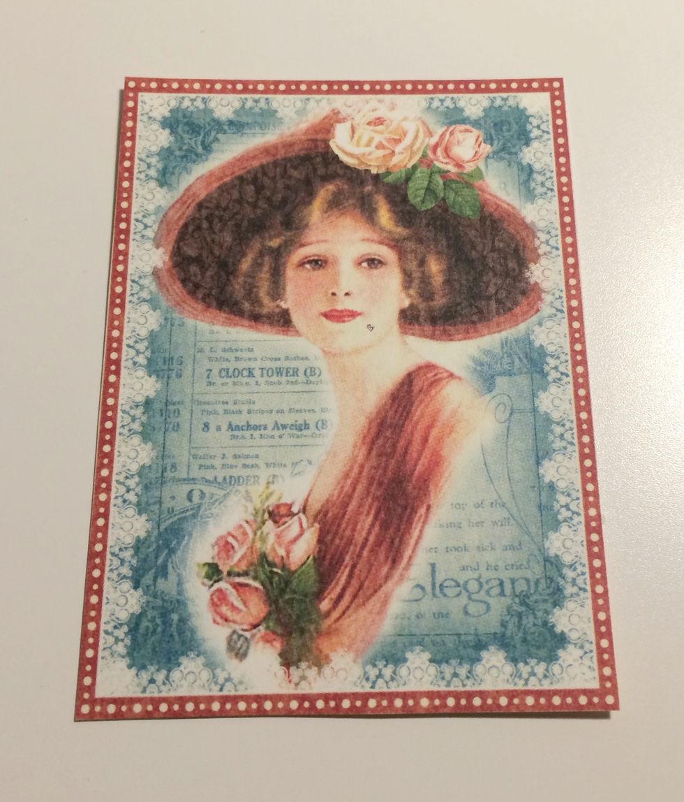 From the ephemera collection, pick out this lady. Trim around her so that you have her and the red border left around her.