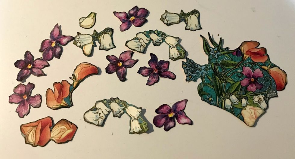 From the floral paper, you'll need to cut out some more flowers. You'll need a total of 12 smaller flowers and 1 bunch of flowers. Ink the edges of the flowers using Photogenic Ink & a blending tool.