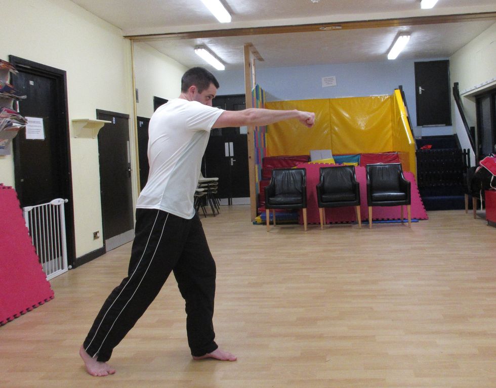 From the guard position, I rotate the body across and punch with the rear hand. The further I twist the body, the more range I can get.